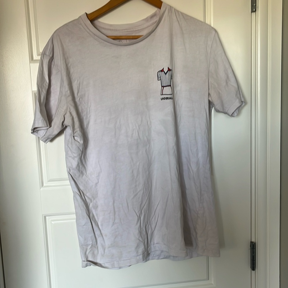 Birds of Condor white tee. Caddyshack Underall outfit on front.